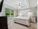 Bedroom features carpet, a ceiling fan, a bed, windows, and matching bedside tables at 195 Bluebird Ln, Salisbury, NC 28146