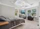 Spacious bedroom featuring carpet, a ceiling fan, windows, and a tv at 195 Bluebird Ln, Salisbury, NC 28146