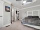 Cozy bedroom with a ceiling fan, carpet, a queen bed, and built-in bookshelves at 195 Bluebird Ln, Salisbury, NC 28146