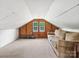 Upstairs bonus room with a sofa and natural light from two windows at 195 Bluebird Ln, Salisbury, NC 28146