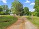 View of the gravel driveway leading to the house at 195 Bluebird Ln, Salisbury, NC 28146