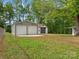 Two-car garage with a concrete slab and a yard at 195 Bluebird Ln, Salisbury, NC 28146