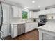 Modern kitchen featuring white cabinetry, stainless appliances, and marble countertops, perfect for cooking at 195 Bluebird Ln, Salisbury, NC 28146