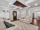 Cozy living room with designer touches, featuring a decorative wood ceiling and stylish furniture at 195 Bluebird Ln, Salisbury, NC 28146