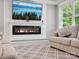 Modern living room with a sleek fireplace, large TV, and comfortable seating for relaxation at 195 Bluebird Ln, Salisbury, NC 28146