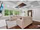 Inviting living room with coffered ceiling, modern fan, neutral walls, and a large picture window at 195 Bluebird Ln, Salisbury, NC 28146