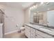 Bright bathroom featuring double vanity, granite countertops, and shower with glass door at 19812 Elise Caroline Aly, Davidson, NC 28036