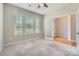 Bright bedroom with 3 large windows, neutral walls and plush carpet flooring at 19812 Elise Caroline Aly, Davidson, NC 28036