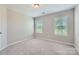 Well-lit bedroom featuring two windows and neutral-toned carpet at 19812 Elise Caroline Aly, Davidson, NC 28036