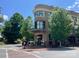 Corner building features rounded architecture, large windows, and a street-level restaurant at 19812 Elise Caroline Aly, Davidson, NC 28036