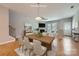 The dining area seamlessly connects to the living room, complete with a fireplace and abundant natural light at 19812 Elise Caroline Aly, Davidson, NC 28036