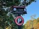 Decorative sign featuring a wagon directing visitors to the Farmers Market and Public Parking area at 19812 Elise Caroline Aly, Davidson, NC 28036