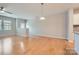 Spacious living room with hardwood floors and neutral walls, perfect for entertaining at 19812 Elise Caroline Aly, Davidson, NC 28036