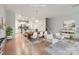 Open-concept living area seamlessly combines dining and living spaces, enhancing the home's modern appeal at 19812 Elise Caroline Aly, Davidson, NC 28036