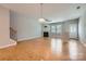 Large living room featuring hardwood floors, a fireplace, and access to the outdoors with ample natural light at 19812 Elise Caroline Aly, Davidson, NC 28036