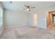 Spacious main bedroom featuring a ceiling fan and neutral walls at 19812 Elise Caroline Aly, Davidson, NC 28036