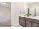 Stylish bathroom features double vanity with granite countertop, and tile flooring at 20396 Queens St, Cornelius, NC 28031