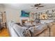 Cozy living room with a brick fireplace, built-in shelving, and a comfortable gray sofa at 211 General Stonewall Jackson Dr, Stanley, NC 28164