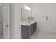 Bathroom with vanity, marble countertop, gray cabinets, large mirror and tile floor at 2185 Loire Valley Dr, Fort Mill, SC 29707
