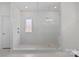 Modern bathroom featuring a glass-enclosed shower with textured tiles and contemporary fixtures at 2185 Loire Valley Dr, Fort Mill, SC 29707