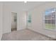 Well-lit bedroom with neutral carpet, white walls, and large windows with views at 2185 Loire Valley Dr, Fort Mill, SC 29707
