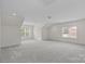 Large bonus room with neutral walls, carpet, and two windows offering plenty of light at 2185 Loire Valley Dr, Fort Mill, SC 29707
