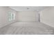 Spacious bonus room with neutral decor and large windows, providing ample natural light at 2185 Loire Valley Dr, Fort Mill, SC 29707