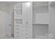 Bright closet featuring white built-in shelving and drawers for ample storage at 2185 Loire Valley Dr, Fort Mill, SC 29707