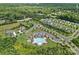 Aerial view of community amenities including pool, playground, and clubhouse surrounded by lush greenery at 2185 Loire Valley Dr, Fort Mill, SC 29707