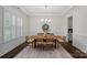 Formal dining room with decorative wainscoting and a statement chandelier, ideal for hosting gatherings at 2185 Loire Valley Dr, Fort Mill, SC 29707