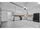 Spacious garage featuring white cabinets, ample lighting, and modern appliances at 2185 Loire Valley Dr, Fort Mill, SC 29707