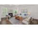 Bright living room boasts coffered ceilings, fireplace, and stylish decor at 2185 Loire Valley Dr, Fort Mill, SC 29707