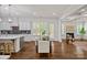 View of dining area and living room boasts coffered ceilings, fireplace, and stylish decor at 2185 Loire Valley Dr, Fort Mill, SC 29707
