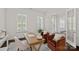 Bright office space featuring an antique desk, large windows, and comfortable seating area at 2185 Loire Valley Dr, Fort Mill, SC 29707