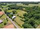 Expansive land featuring a residence and outbuildings with a long private driveway at 2315 Lanesboro Rd, Marshville, NC 28103