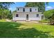 Backyard features a level yard with flower beds, mature trees, and shade at 2315 Lanesboro Rd, Marshville, NC 28103