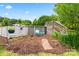 Secluded above ground pool with lattice fencing, landscaping, and seating area at 2315 Lanesboro Rd, Marshville, NC 28103