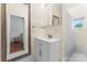 Clean and classic bathroom with a white vanity, mirror, and tile accents at 2315 Lanesboro Rd, Marshville, NC 28103