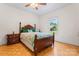 Comfortable bedroom with hardwood floors and bright window showcasing green outdoor views at 2315 Lanesboro Rd, Marshville, NC 28103