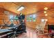 Bright gym area with hardwood floors, multiple windows, and exercise equipment at 2315 Lanesboro Rd, Marshville, NC 28103