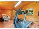 Well-equipped gym featuring wood paneling, natural light, and various exercise machines at 2315 Lanesboro Rd, Marshville, NC 28103
