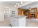 Open-concept kitchen with white cabinets and a granite island that blends into dining and living space at 2315 Lanesboro Rd, Marshville, NC 28103