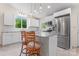 Bright, well-lit kitchen with a granite island and stylish pendant lighting, perfect for entertaining at 2315 Lanesboro Rd, Marshville, NC 28103