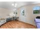 Cozy living area featuring wood floors, a chair, and a door leading to the outside at 2315 Lanesboro Rd, Marshville, NC 28103