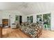 Bright sun room with paneled ceiling and walls of windows provides ample natural light and green outdoor views at 2315 Lanesboro Rd, Marshville, NC 28103