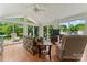 Bright sun room with paneled ceiling and walls of windows provides ample natural light and green outdoor views at 2315 Lanesboro Rd, Marshville, NC 28103