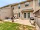 Backyard patio with a grill, seating, and a sliding glass doors to the house at 2331 Whitford Ln, Charlotte, NC 28210