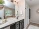 Stylish bathroom featuring a double vanity, modern fixtures, and ample counter space at 2331 Whitford Ln, Charlotte, NC 28210