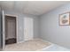 Neutral bedroom with two doors, modern artwork, and a carpeted floor at 2331 Whitford Ln, Charlotte, NC 28210