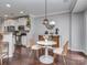 Cozy breakfast nook next to the kitchen, featuring a modern light fixture and comfortable seating at 2331 Whitford Ln, Charlotte, NC 28210